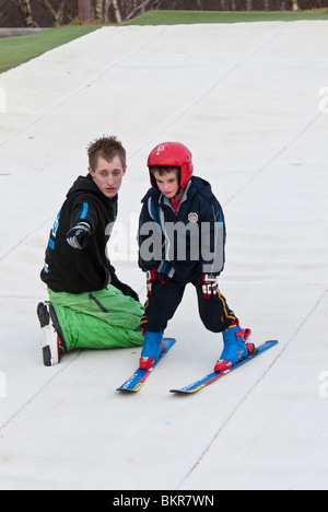 Child Learning to Ski at the Dry Ski Slope in Warmwell Dorset UK Stock Photo