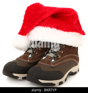 Woman's tie up (lace up) weather proof snow boots with Santa hat. Stock Photo