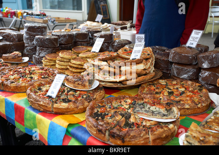 selection of quiches and savoury products on a bakery stall at an outdoor market Holywood County Down Northern Ireland UK Stock Photo