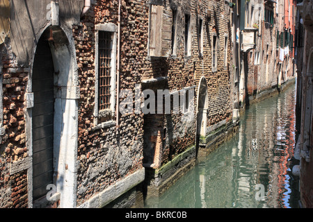 Narrow canal 'Rio de San Cassian' in Venice, Italy Stock Photo