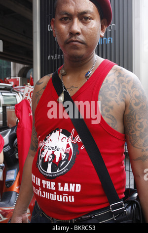 A tattooed Red shirt demonstrator campaigning for the return of disgraced PM Thaksin Shinawatra, in central Bangkok. Stock Photo