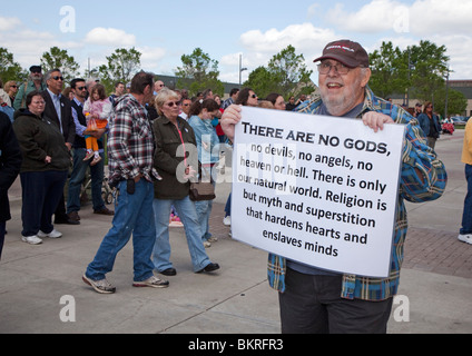 Warren, Michigan - A dissenter carries a sign denouncing religion during a National Day of Prayer observance at City Hall. Stock Photo
