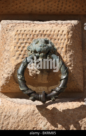 A bronze horse tethering ring in the form of a lion's head on the wall of the Palacio de Carlos V, Alhambra, Granada, Spain, Europe Stock Photo
