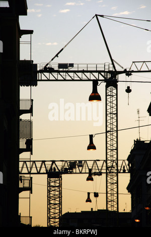 cranes on building site in city town Stock Photo