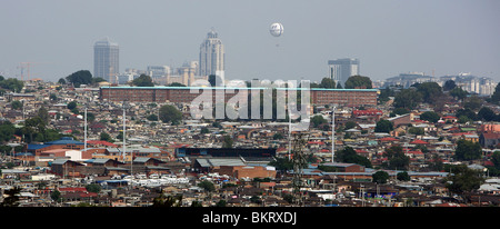Look over Township Alexandra on to luxury district Sandton City in the background with its hotels and shopping complexes Stock Photo