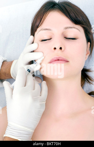 Syringe. Botox, cosmetic medicine. Botulinum toxin treatment involves ...