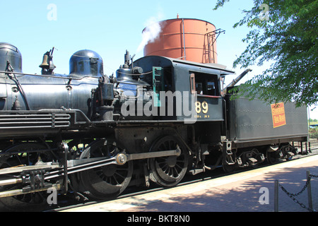 The Strasburg Rail Road Company excursion train passes by the railroad crossing in Strasburg Stock Photo