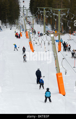 Skiers and ski lifts at Levi ski resort, Finland Stock Photo