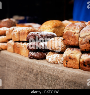 Loaves of bread for sale outside a bakery at Borough Market London England UK Stock Photo