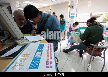 Unemployed people look for jobs in job service station. Stock Photo