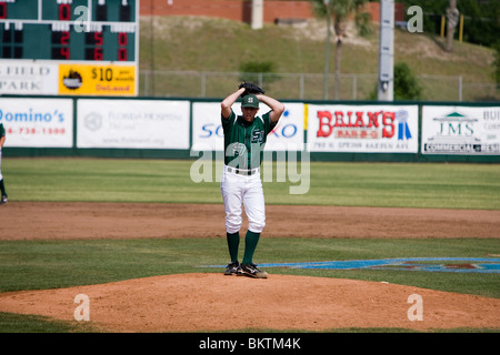 Baseball pitcher winding up for a pitch Stock Photo