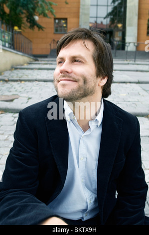 Man sitting on stairs Stock Photo