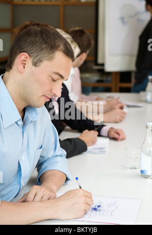 Businessman taking notes Stock Photo