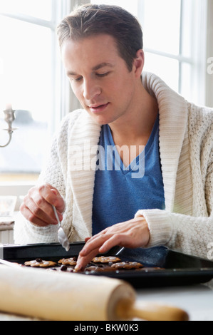 Person baking Gingerbread man cookies, Person hands in dough with ...