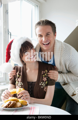 Man and woman with christmas hat and lucia bun Stock Photo