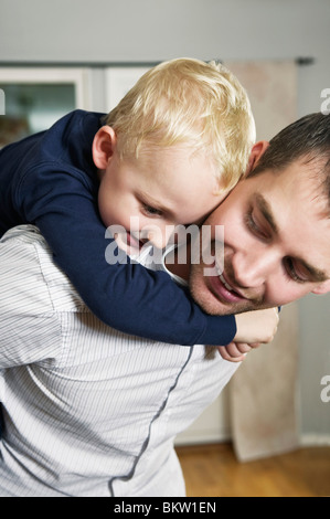 Boy and dad playing Stock Photo