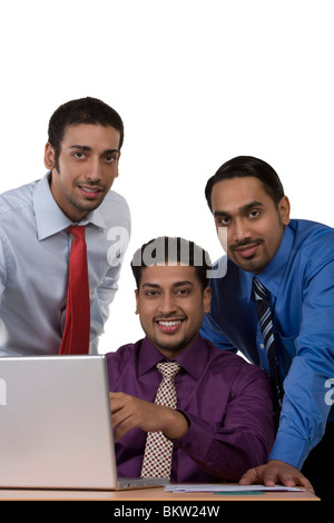 Portrait of smiling business people against white background Stock ...