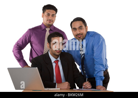 Business people against colored background, portrait Stock Photo