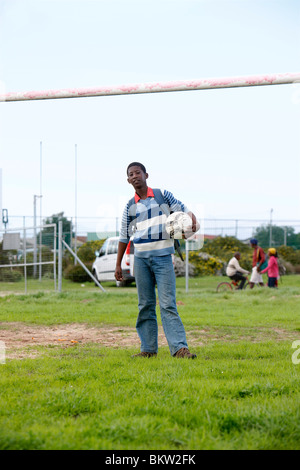 Young boy with Soccer Ball in Township, Cape Town Stock Photo