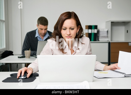 Concentrated coworker at office Stock Photo