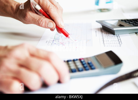 Closeup hand and calculator Stock Photo