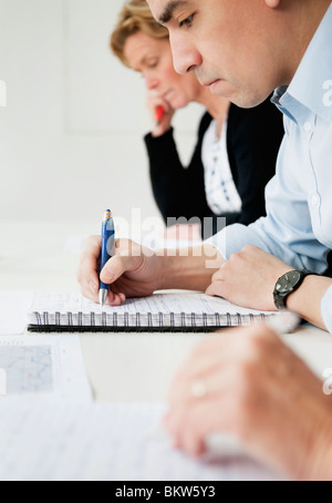 People taking notes Stock Photo