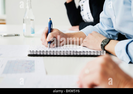 Writing in notebook Stock Photo
