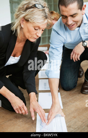 Colleagues studying statistics Stock Photo