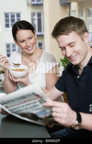 Couple reading newspaper Stock Photo