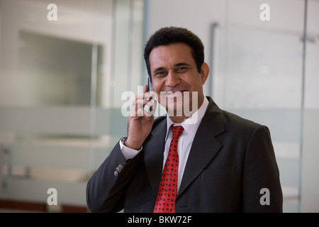 Businessman talking on his cellphone Stock Photo