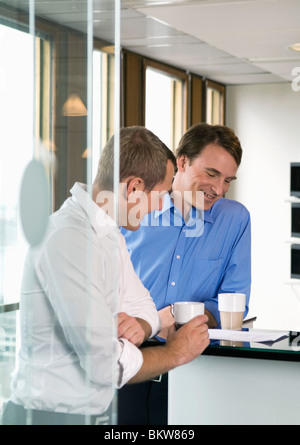 Colleagues discussing document Stock Photo