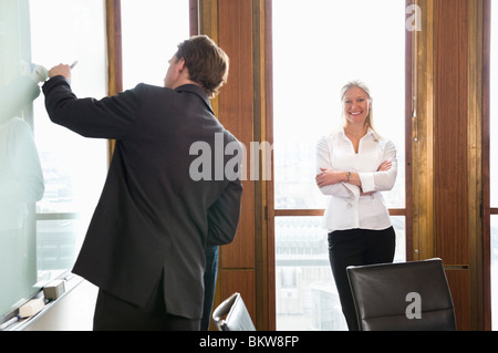 Two people in conference room Stock Photo