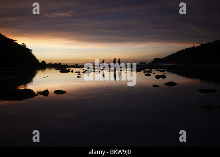 Sunset on Mai Nam Beach in Ko Surin marine national park, in Thailand. Stock Photo