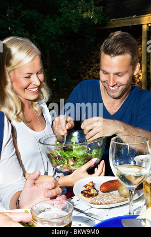 Man grabbing salad Stock Photo