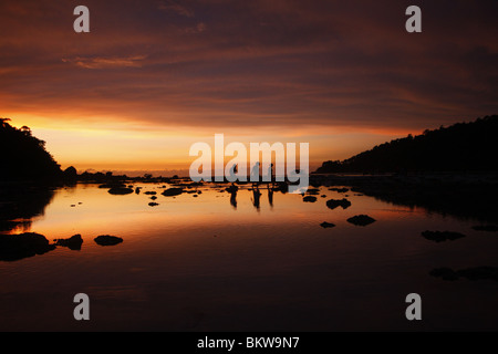 Sunset on Mai Nam Beach in Ko Surin marine national park, in Thailand. Stock Photo