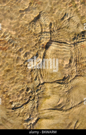 Ripples in water over sandstone slab Stock Photo