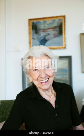 Elderly woman in apartment Stock Photo