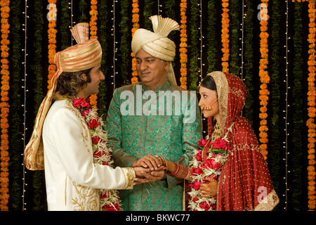 Indian man showing support to the newly wed couple Stock Photo