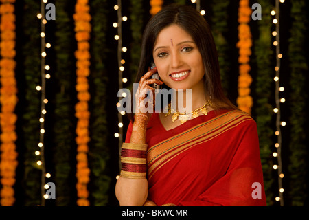 Young Indian woman using her cellphone Stock Photo