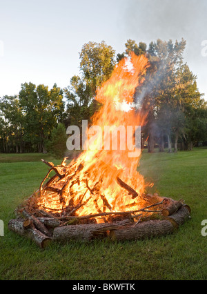 bonfire fire outdoors wood rural large flames burn burning outside Stock Photo