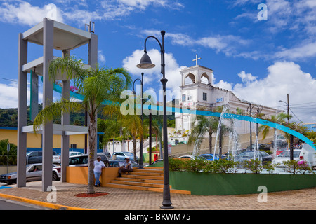 The town square in Yabucoa, Puerto Rico with decorative water fountain and church. Stock Photo