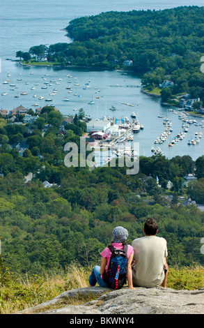 Stock photograph of young couple viewing Camden Harbor from  Mount Battie in Camden Maine USA Stock Photo