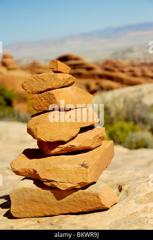 Stock photograph of a lizard sunning itself on a rock cairn marking Devil's Garden trail at Arches National Park, Utah, USA. Stock Photo