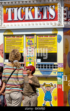 Stock photograph of family at carnival ticket booth, Los Angeles County Fair, Pomona, California, USA. Stock Photo