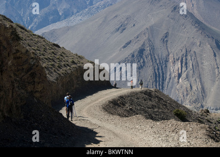 Trekkers on jeep road,near Kagbeni, Annapurna Circuit, Mustang District, Nepal. Stock Photo