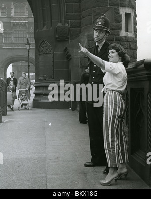 CONNIE FRANCIS  American singer  and film actress with a policeman on London Bridge in 1960 Stock Photo