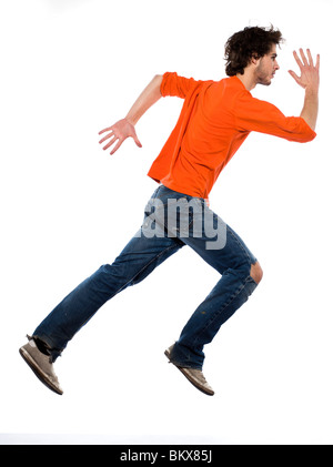 young running caucasian man portrait in studio on white background Stock Photo