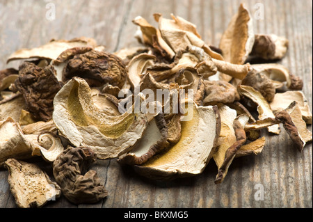 Close-up Of Dried Porcini Mushrooms On Wooden Table Stock Photo