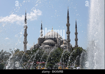 The Sultan Ahmed Mosque or The Blue Mosque, as seen through a fountain in Istanbul, Turkey. Stock Photo