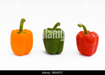 red yellow and green peppers isolated on white Stock Photo